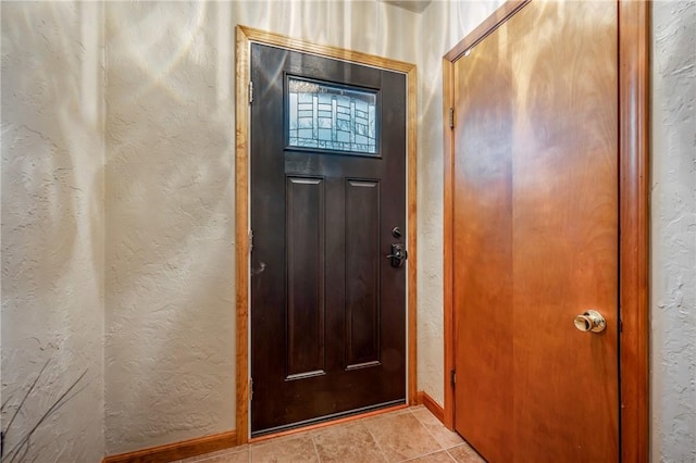 entryway featuring light tile patterned floors