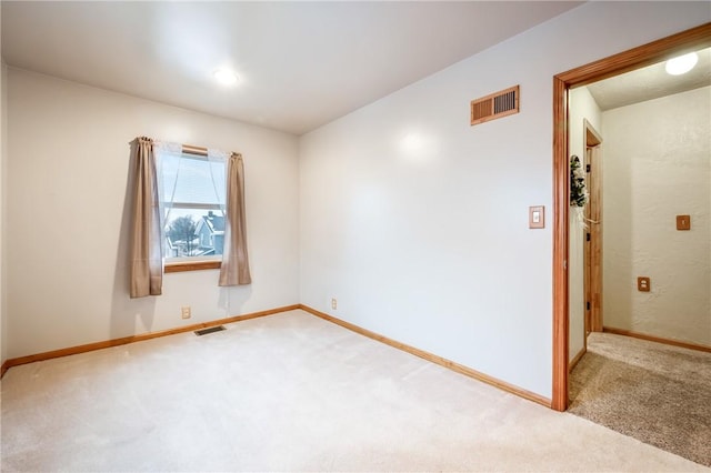 spare room featuring carpet floors