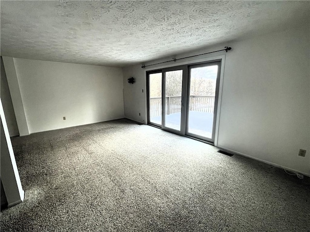 empty room with a textured ceiling