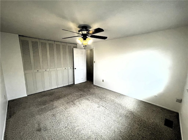 unfurnished bedroom featuring ceiling fan