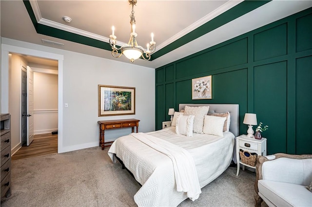 bedroom featuring an inviting chandelier, ornamental molding, a raised ceiling, and carpet flooring