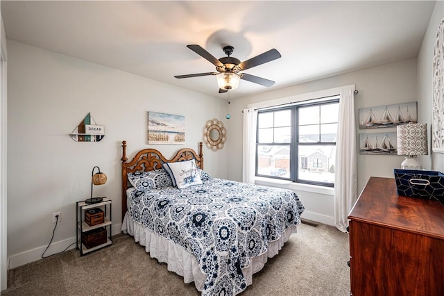 bedroom with ceiling fan, carpet floors, visible vents, and baseboards