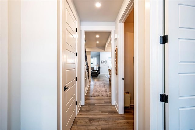 corridor featuring dark hardwood / wood-style flooring