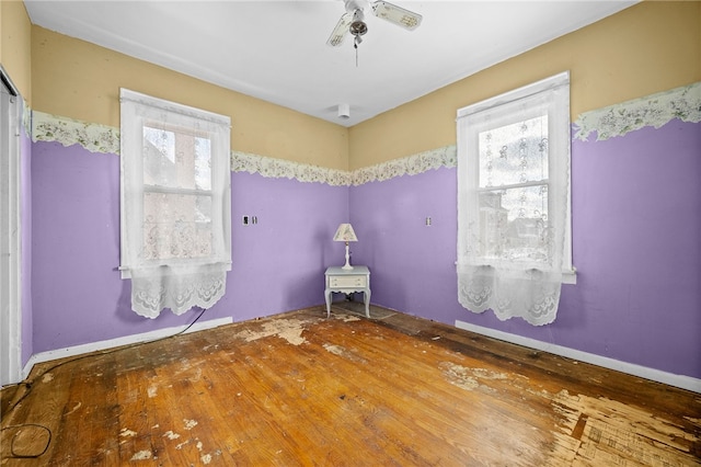 bathroom featuring ceiling fan and a wealth of natural light