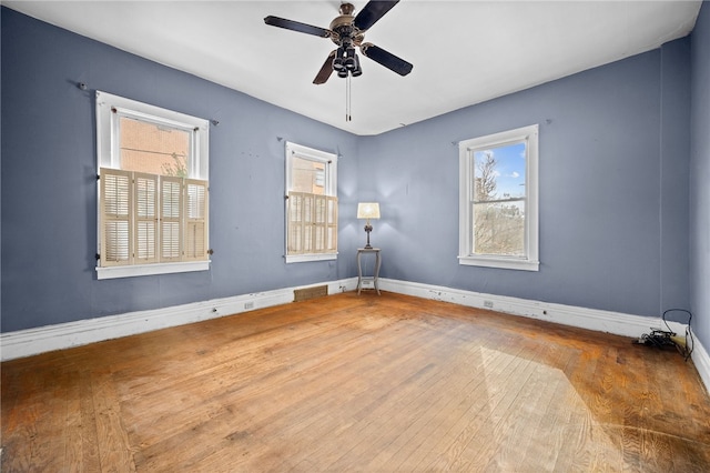 empty room featuring ceiling fan and wood-type flooring