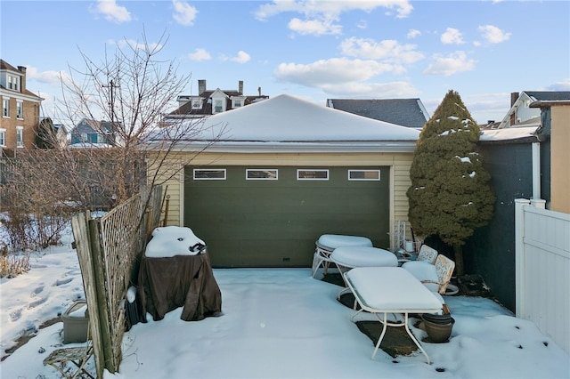 view of snow covered garage