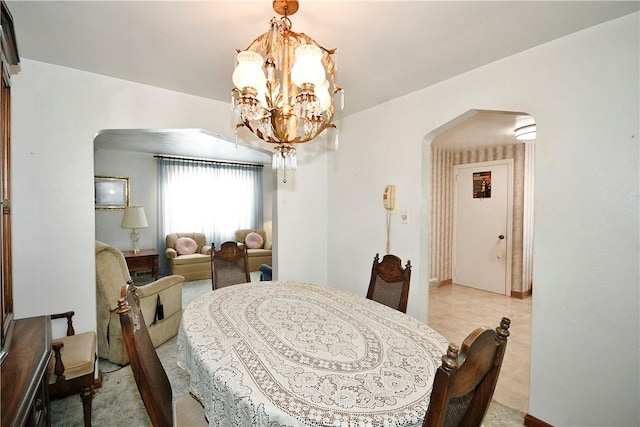 dining space with a chandelier