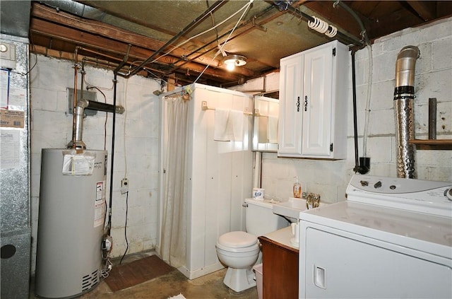 washroom featuring washer / dryer, water heater, and sink