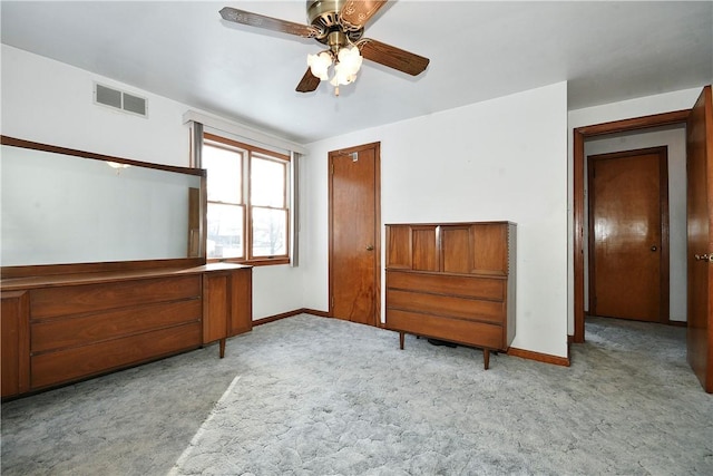 unfurnished bedroom featuring ceiling fan and light carpet