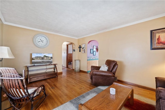 living room featuring wood-type flooring and crown molding