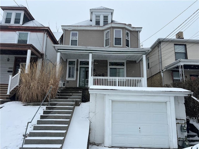 view of front of house featuring a garage and a porch