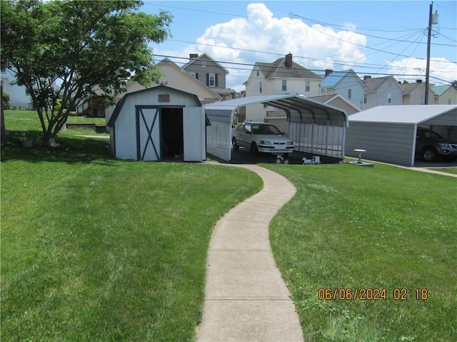 view of yard featuring a shed and a carport