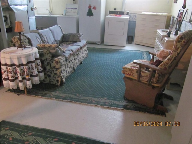 sitting room featuring washer / clothes dryer