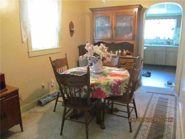 dining space with plenty of natural light and sink