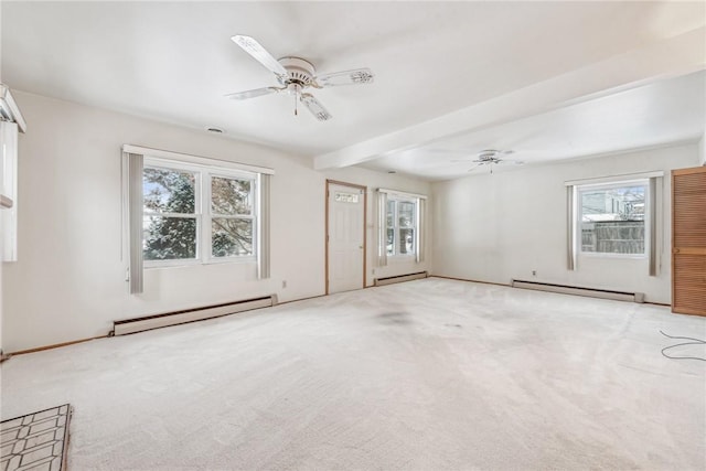 carpeted spare room with baseboard heating and ceiling fan