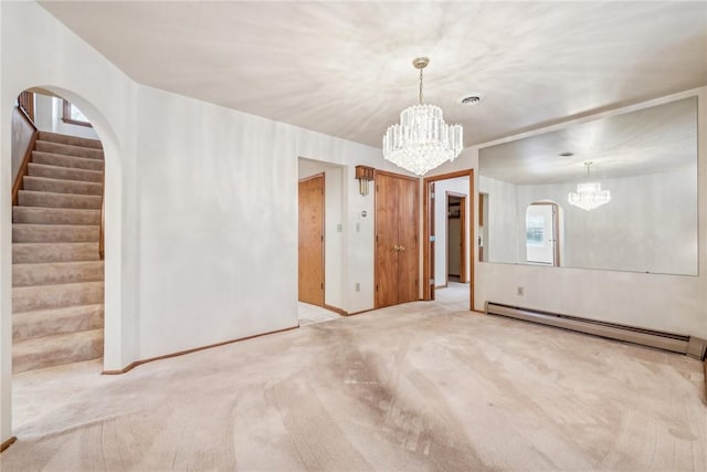 carpeted empty room featuring a notable chandelier and a baseboard radiator