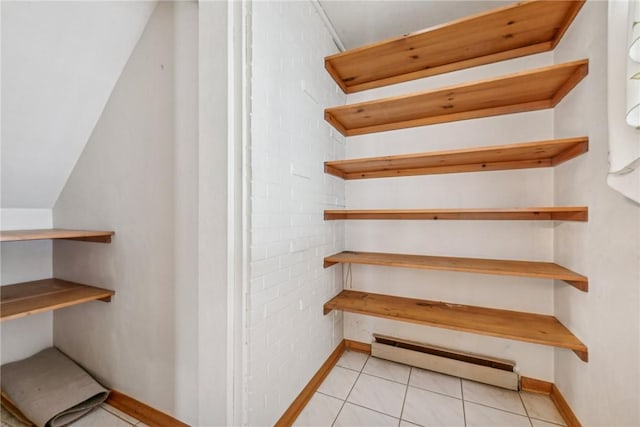 pantry with a baseboard heating unit