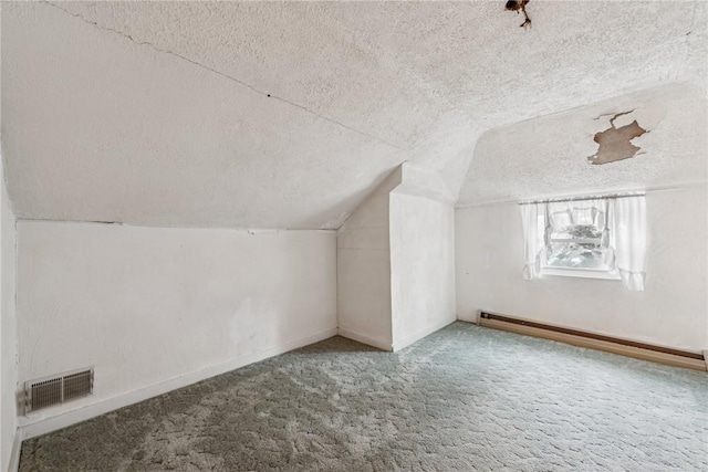 bonus room with a textured ceiling, carpet, lofted ceiling, and a baseboard radiator