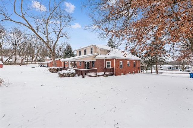 view of snow covered house