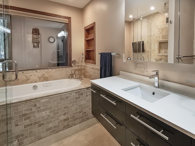 bathroom featuring vanity, tile patterned floors, and shower with separate bathtub