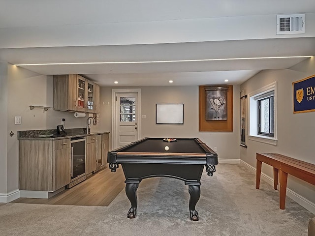 recreation room featuring indoor wet bar, wine cooler, pool table, and light colored carpet