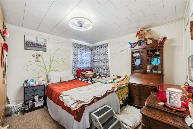 carpeted bedroom featuring crown molding