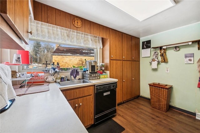 kitchen with dishwasher, sink, and dark hardwood / wood-style flooring