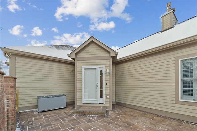 property entrance featuring a patio