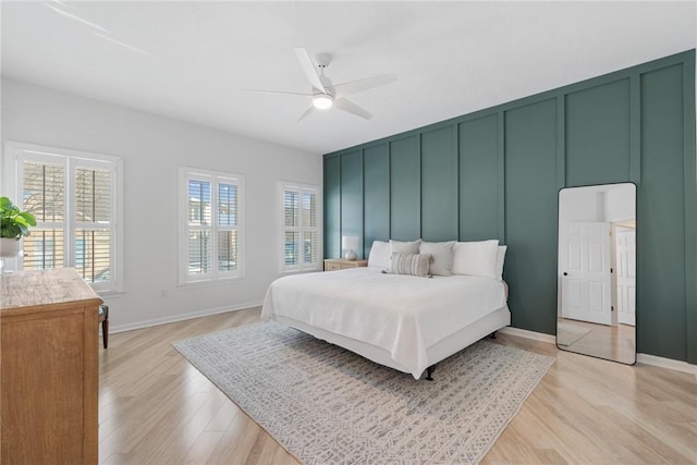 bedroom with ceiling fan and light wood-type flooring