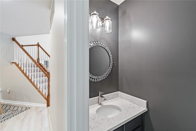 bathroom with hardwood / wood-style floors and vanity