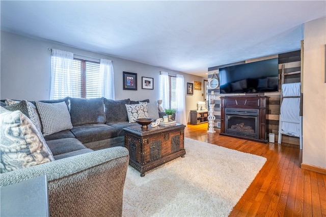 living room featuring hardwood / wood-style flooring and a healthy amount of sunlight