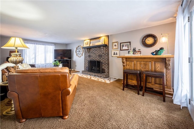 carpeted living room with a fireplace