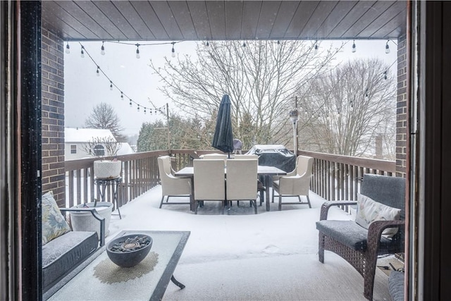 view of snow covered deck