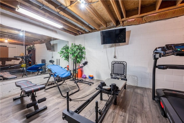 workout room with wood-type flooring