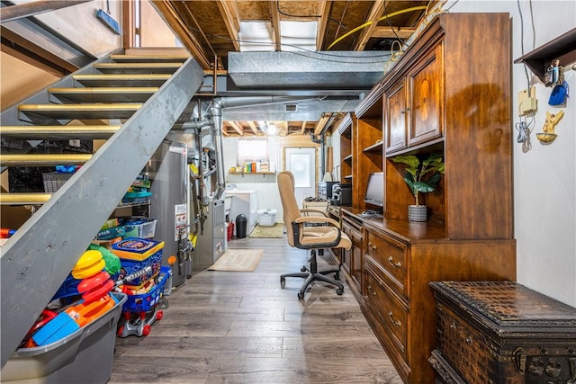 basement featuring dark hardwood / wood-style floors