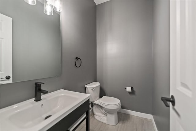 bathroom with toilet and vanity