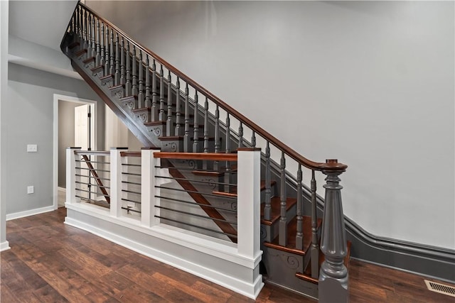 stairs featuring wood-type flooring