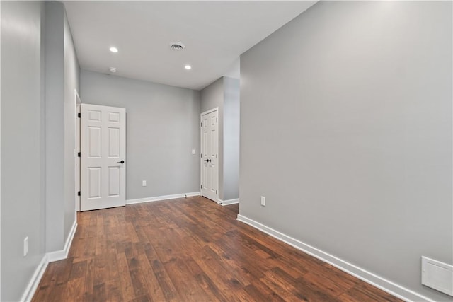 spare room featuring dark hardwood / wood-style floors