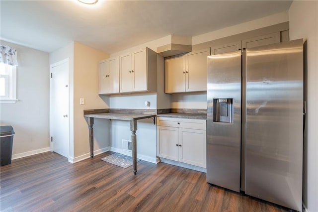 kitchen featuring white cabinets, stainless steel refrigerator with ice dispenser, and dark hardwood / wood-style flooring