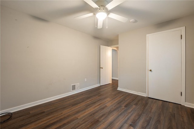 unfurnished bedroom with dark wood-type flooring and ceiling fan