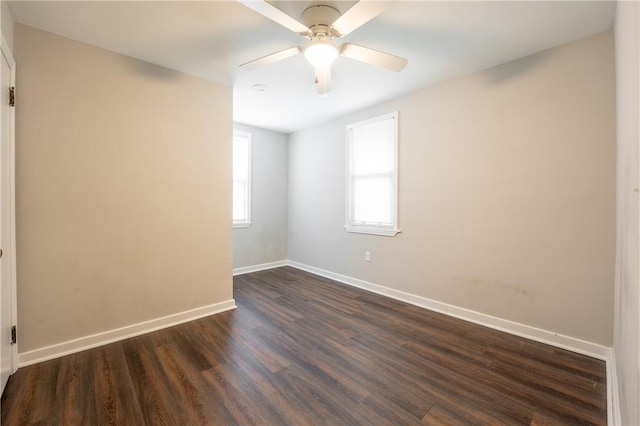 unfurnished room featuring ceiling fan and dark wood-type flooring