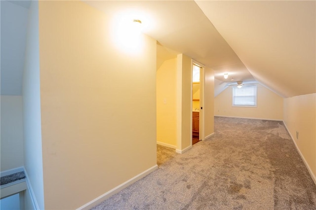 bonus room with carpet and lofted ceiling