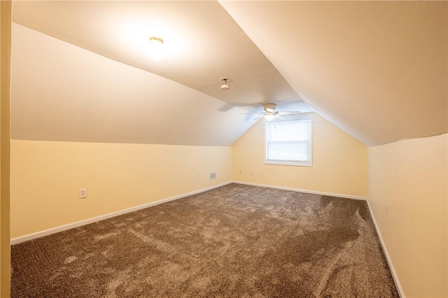 bonus room with lofted ceiling, ceiling fan, and carpet flooring