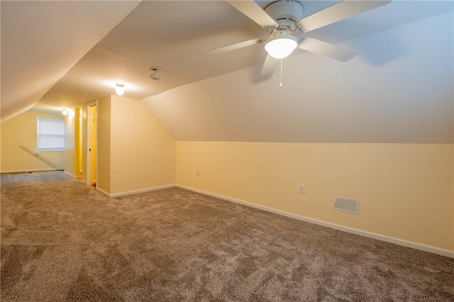 bonus room with ceiling fan, lofted ceiling, and carpet floors