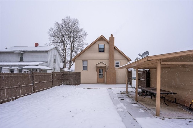 view of snow covered house