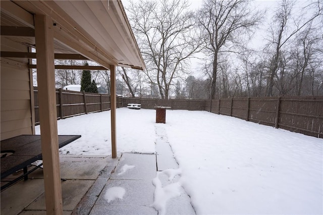 view of yard layered in snow