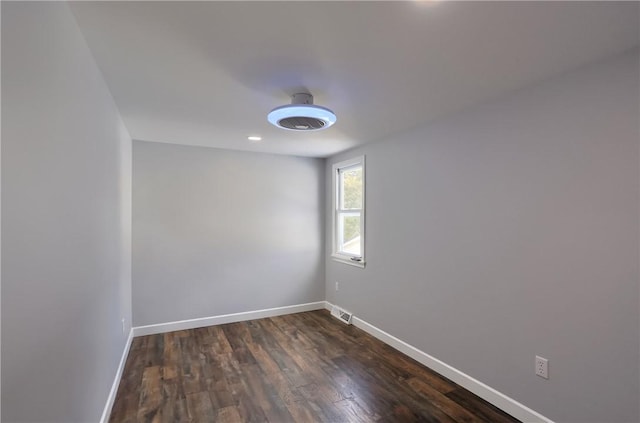 empty room featuring dark hardwood / wood-style floors