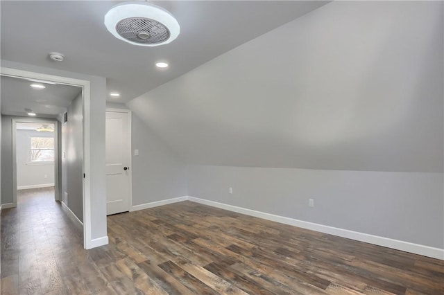 bonus room with lofted ceiling and dark hardwood / wood-style floors