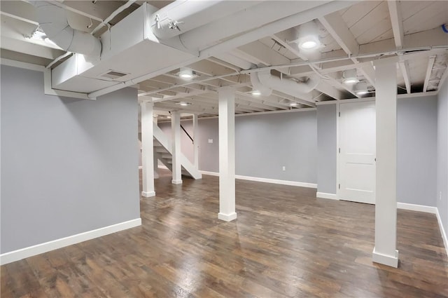 basement featuring dark hardwood / wood-style floors