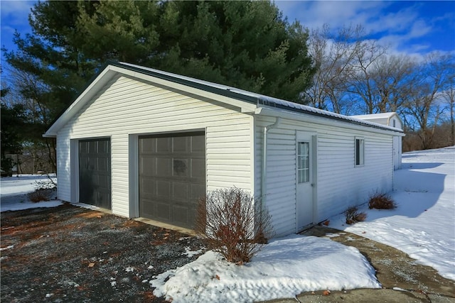 view of snow covered garage